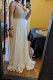 Decided not to keep it as it felt a little too informal for my wedding, but if I had been doing a beach ceremony, perhaps! It fits beautifully in the chest, but the strap in the back would have needed a fix so it didn't bag just slightly on the bottom in the back. Otherwise, it felt slimming and was beautiful and wasn't so long that I felt like my shorter frame was drowning in it. A nice dress for another occasion! - Kathryn A.