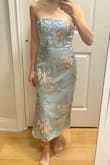 The top is really pretty but I don't love the stiffness of the skirt. I have a 24 inch waist and was surprised that it fit snug. I decided on a different option for my event but thought this was a nice option. - Danielle Z.