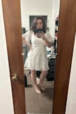 I'm usually hesitant about white dresses because they are see through. This dress will still need a slip underneath in my opinion but it's a lot less see through than other dresses. It's a great length and the sleeves are so cute. - Erin B.