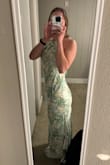 This dress is beautiful! The front is simple and the back is absolutely gorgeous. The material looks great in person. Slit is a little high but the dress is great. - Emily M.