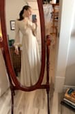 I love this dress! I always get wrap dresses when ordering online because there is a bigger chance of it fitting. This worked out perfectly for me! I got the dress in cream (as requested by the bride) for my bridesmaid dress! I love the wrap dress style because I can make it perfectly fit my waist. I didn't find it too low cut at all. But I will definitely be wearing nipple stickies underneath this colour. And the fabric feels thick and good quality. Will be shortening it a bit, but that's fine, I'm just short. Genuinely wish I could have this dress in every colour! - Amber P.
