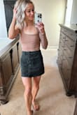 I love this skirt so much! The denim is excellent quality, and the buttons and pockets are such a cute touch. There is no stretch at all, and I was worried about it being too small based off of other reviews. I ordered a small, and it was too big, so I returned it for an extra small. The extra small fits perfect! I would say it runs true to size. - Stephanie H.