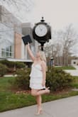 This dress was perfect for a college graduation! I absolutely loved it; it's the perfect white dress. Tiny cut outs on the side and so frilly! - Alexa M.