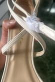 My fiancé chose those sandals for our wedding and when I opened the box they came in, they seemed used as they're peeling. - Istmania S.