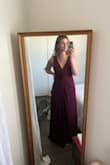 The color is just completely wrong. The photo shows it's a dark red, like almost crimson, but the dress in person is wine red and wayyy cooler. Be careful- this is not true to color! I should've known better that this would be an issue since it's on sale. It's a cute dress, and I liked the fitting (except for the weird flap that's sewn together oddly in the middle). But for trying to match the color for a bridesmaid dress, you cannot rely on the picture. Boo to the photographer that edited the photo and altered the color of the dress - Alison W.