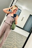 I was very pleased with this jumper! Super comfortable all around; the fabric is light and thin. Love the pockets and the tie up straps. I can easily move in it, which I need to do for work. Because the fabric is so thin, it will easily show sweat, so I'm ordering the black one for work and keeping the tan one for lounging. - Krista S.