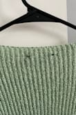 The sweater is not sage green and is poorly made. The black threads for the tag are visible on the back. - Brooke A.