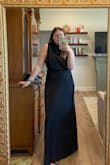 This dress is so beautiful!! It fits absolutely perfect. The stomach area and around the neck are not tight so it's easy to move around in. It's flattering in all the right places! - Jacie H.