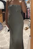 It fits really nicely. The length is perfect, which I was worried about. It stays up at the top even without straps. The material is nice and the same color as the photo. - Erika V.