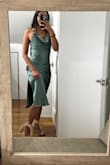 I love the fabric; the green is shiny and very elegant. The rose pattern is a stitch not just pressed on. I will be getting it hemmed, but that is a personal choice on how I like the length of my dress. - Marilyn C.