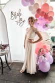This was a beautiful dress! I got so many compliments on it. I wanted something a little different for my shower and this was perfect. It did run a little big - I probably could've gotten away with an XS but kept the small & got it altered. Absolutely loved it. - Danielle I.