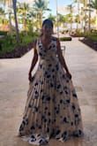 This dress is so beautiful! I wore it on vacation for a dinner and was perfect on the beach. It is a little heavy and runs a little long but overall it was easy to walk around, it flows really nicely. - Angela I.