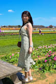 I got this dress for a mini photoshoot for spring and it was perfect, long enough so the wind wouldn't blow it up, and it hugged my body nicely! The color was just what I looking for. It fits true to size! - Angela I.