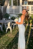 We had it taken in a little on the bust area and the waist. The pearl beading and sequins really made this dress stand out. - Jen O.