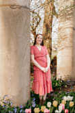 I had bought this dress for family photos and loved the color when I first tried it on. I wish I had paid more attention to the cut of the dress. The slit on this dress is VERY high. And for a tall person, it is dangerous. I ended pinning a lot of the underskirt slit because it was uncomfortably high. If you are a part of the itty bitty ti*** committee, I did not fill out this dress and that required some extra pins as well. I might just need to get the whole thing altered. I wanted to love this dress but I'm not sure I'll break it out again in fear that I might flash someone more than they should see. - Mary S.
