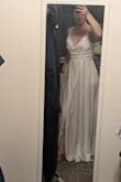 Super comfortable and flowy, but with some ribbing/structure in the bodice. Love that it has pockets!! They are slightly visible through the material but manageable. - Michelle M.