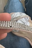 I really did like the shoes for the price however, they do run a bit small. Generally, I always wear a five but I would either size up, one whole size or half a size.
Only thing I noticed wrong with shoes was this black little gem. Odd but even hardly notice it. - Wendy M.