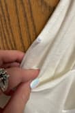 Pretty disappointed I just got my dress out of the bag, I am supposed to be wearing it Thursday for my wedding. Where the metal wiring is along the cleavage the wire is coming out. This is going to be uncomfortable poking me and will hopefully be hid in photos. - Ronee E.