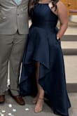 The moment I put this on I was in love with the material and elegant look. It had no stretch though and my husband had to help me get it zipped up. I would have ordered a bigger size but they didn't have a bigger size. Overall loved it and got lots of compliments on it. - Olga G.
