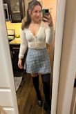 This skirt fits very well and is very well made, but the design of it is quite unique which makes it a bit challenging to style. It is a wool blend and has a line of sparkle to it as well. I do still find it very cute, but just keep that in mind if you plan to purchase. - Megan C.