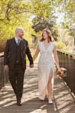 This dress was a great fit for me. I loved the thigh slit that shows off my beautiful legs and the sleek elegant low neckline that complements my teardrop pearl necklace. I did use body tape around the neckline to keep it close to my skin, but otherwise, it fit me perfectly. - Brittany H.