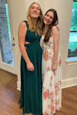 This dress is absolutely beautiful. The colors are great; the skirt is very full with a great swing to it, and it's got a satin lining that makes it so comfortable to wear. It's a true wrap around dress with ties, which also means it will fit tighter or looser in places as needed. Stunning! - Stephanie O.