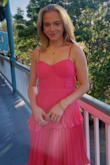 I had a spring wedding in New Orleans to attend and could not decide on a dress. I ordered a few including this one and it stood out immediately! The color! The tiers! The ruffle! The fit! It was very comfortable to wear and still formal for the event. At the wedding I got so many compliments on the dress. The dress made me feel and look amazing!! - Katie K.