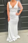 I couldn't ask for a better fitting dress for my elopement with no alterations. I would say it is a true 6. (Weird complaint but I hate that you could see where my belly button was) In the picture, I do not have my heels on. - Katie H.