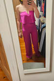I had high hopes for this but was greatly disappointed. The material is stretchy and cheap feeling, and even though I loved the idea of pink, the whole thing felt cheap. It's also HOT and does not breathe. It clings to you so I'm not sure what undergarments you could wear, if any, and it accentuates any sort of belly or bump you have. Maybe it could work if you wear tummy control shorts that go up to your bust that would give you the control you need while hiding panty lines? The navy blue is more forgiving so I might consider trying that approach. Honestly, I'm surprised there aren't more negative reviews on this. - Ann H.