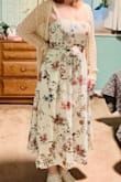 I held off from ordering from Lulus for far too long. I'm so glad I finally did because this is the perfect dress for my Italian vacation. I will agree that the photo shows a crisp white dress, and it does have more of a cream background color. However, for me, it works even better. I will also agree that it would be nice for the straps to be adjustable, but they have stayed on my shoulders. A regular bra does not work as it shows in the front where the straps are connected to the dress. It has enough support for me to wear Cakes nipple covers and go braless. However, having adjustable straps would provide a little more lift to the girls. I am so happy with this dress. Thank you Lulus for providing this quality staple for my upcoming vacation. - Alicia J.