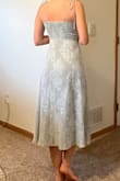 I got this dress for a beach wedding in December. I love that it works in any season and the length is perfect to be safe from any wind mishaps. The straps are ties so they are adjustable. The chest area as a tad bit too much room for me but still lays nicely. The dress stretches in the back and zips on the side so it's easy to get on and should work for all body types. Slit is not so high so I can still wear shorts underneath. The fabric quality is great with a bit of texture and sparkle, the dress is lined so it's not see-through. LOVE! - Aliah D.