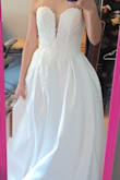 The dress is gorgeous. The slit is definitely waaaaay too high. It pretty much reached my lower abdomen. The top part and all the intricate and delicate beads are beautiful. The dress fits snugged for a size 2. I think this fits like an xs. If you are having a ceremony outside a church wear this. For me, it won't work. And my wedding is this winter. The dress is too heavy and I would need several alterations: adding sleeves or getting a topper, closing the slit, and shortening the length. So, if all you have to do is close up the slit a little and hem, then alterations not too bad. I will be returning, I ordered a different dress from Lulus. - Yuki G.