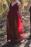 This dress is gorgeous. It was a little big in the chest area for me, and I had to have it sewn up a bit; I had the bottom hemmed too. The back is beautiful! - Learsi A.