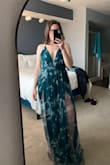 Fits my frame well. Sits comfortably. Adjustable straps, perfect. A bit long with 3 inch heels - took it to the tailor (not pictured). Flowy and fun! Excited to wear it to my friend's wedding. - Catherine M.