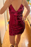 The dress is very pretty and has a nice fit. It was a little hard to get on (can't step into it because narrow at the hips, feels like you're going to lose some sequins while pulling it over your head), but comfy once it's on. It sheds a ton of little black fibers. - Veronica B.