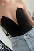 I saw Kristin Cavallari wear a similar body suit and I am so happy I finally found one just like it! It runs small but the wire that outlines the deep V cut holds everything in tight. Perfect with high waisted jeans for a night out. If you are not flat chested. I recommend sizing up. - Ashley H.