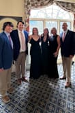 I am between an XL and an XXL. I chose to size up. I loved the way it fit; it was very flattering and extremely comfortable. I typically run a 14/16 and weigh 200 lbs. I really felt great in this dress. I loved the high front line and the low back! - Heather S.