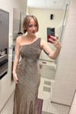High quality fabric, with a lining under. Very forgiving. It stayed in place all night. It was a little long on me, so I wore 3" heels. But because it was stretchy, you can easily hike it up a bit and walk around. :) - Content D.