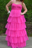 This dress was wonderful!!! It fit really well and was a bit poofy but not bad. Super well priced and made! Loved it for prom! - Kathryn H.