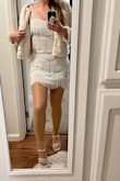Really beautiful piece! Definitely runs very fitted over hips and bum! I ordered a medium and it worked well, but I probably would have been more comfortable with a large bottom. Wore to an eras party and plan to use it for my bachelorette! Fun and flattering! - Victoria L.