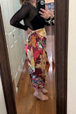 I LOVED this skirt. I purchased a large and probably should have gotten a medium. I was grateful for the slightly extra amount of length as this is a true wrap skirt. The material is very light and very prone to a wardrobe mishap with the slightest breeze. However, the skirt was super comfy, looked great, and I received a lot of compliments! Would totally recommend. - Sara B.