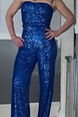 Love love this jumpsuit. It fit amazingly only down side is it is for taller than people. I didn't have time to have it altered but fabric tape worked wonders and some serious heals. I received so many compliments. Best money spent. - Keri D.