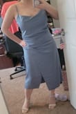 The slate/dusty blue is absolutely beautiful! Its not as bright as it shows on the model though. I bought this in a medium since I am a bit curvy, and that was a good decision. If I see that a dress has a back zipper that looks like it may make the dress tighter, I tend to opt for a medium so there's enough room to fully zip it. Very beautiful and look forward to wearing it for one of the formal nights on my upcoming cruise. - Michelle P.