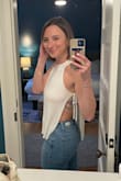 I got compliments on this top all night long. I love the fit and the sexy peek on the sides. I did need to order a no-show, extra lift adhesive bra from NOOD though. - Kate H.