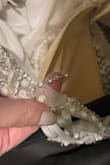 The dress is very beautiful, the color is amazing. I do not recommend it to anyone who has large breasts like me. The dress must be handled with caution. I received the dress with several tears, but its color is very beautiful. I will return it and buy something more comfortable for myself. - Rola H.