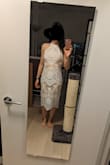 The dress fits great! I will be using it for my bridal shower. I got a small and I'm usually a small or size 2. The material feels good, it's a thick lace design. The zipper is not smooth, that part feels cheap. Also the bottom of the dress limits your walking stride. The lace has no give, a slit would've probably helped with that. There were also a couple snags in the lace pattern when it came. Overall, a very nice dress for the price point. It also arrived relatively quickly. - Luna C.