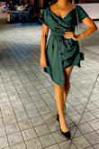 The dress quality is beautiful and it looked stunning the way in the way it fit me. The bottle green color also complimented my brown skin very well. The only shortcoming is that the Medium, which fits me so perfectly was extremely short. I did not realize this until I got into the Uber on the day of the event. I realized I had not tried sitting when I had tried it on earlier. So I was conscious of that the whole night and had to use the front layer to cover up and place my bag on my lap whenever I sat.
Aside from this the dress is truly beautiful and also very comfortable. I danced liked crazy with it and it stayed in place. I did not wear a bra and while the neck is deep, it held everything in place during vigorous dancing. I got a ton of compliments. - Parijat B.