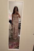 Loved this dress! I wore it with really tall heels because I didn't have time to get it hemmed and I'm short (5'3"), but other than the length (which I knew it would be long) it fit perfectly! Dress is a little more pink in-person, but nothing crazy and I honestly liked it better because it looked less "wedding" like. Material is thick too. I wore it with just breast petals and I and was fine! - Sophie K.