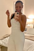 This jumpsuit was perfect. People ask me if it was tailormade bc it fits so well. It was comfortable without being tight. Great length with a 3.5-inch heel. Not see-through at all. I want the black one as well. - Stephanie D.