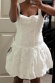 I would like to start this off by saying I have never once left a bad review, and I even hesitated writing this. To start there woman in customer service that helped me find my size was so kind and helpful. I picked a size medium and was really excited to get it as I was planning on this being my graduation dress. I received really early which was great, but when I tried it on it was stiff, and made me look like a tissue. The straps are loose, the back had a bow, but was not flattering and as a whole the bottom of the dress was not what was presented in the picture and I was extremely disappointed and will be returning. Overall if you want to look like an 80s prom dress gone wrong along with a tissue I'd buy this but otherwise save your money. - Meron A.